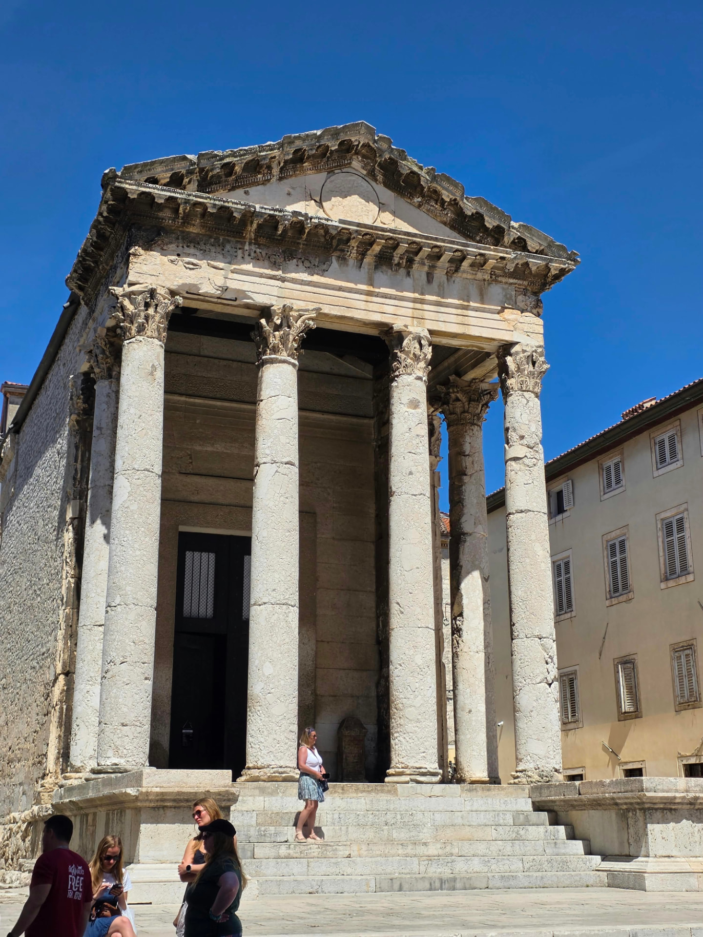 On the temple steps · Pula